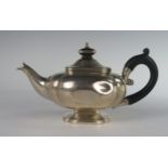 An Edward VII Silver Bachelor's Tea Pot with ebony handle and finial, London 1901, John Parkes, 18.