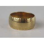 A 9ct Gold Patterned Wedding Band, 18.5mm wide, size K.5, 5g