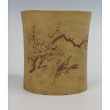 A 19th Century Chinese Terracotta Brush Pot with incised prunus decoration and character parks,