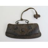 A Hand Made Iron and Leather Tinder Pouch, mounted with twin Swastikas and with