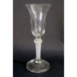 A Large 18th Century Drinking Glass with air twist stem and folded foot, 20.5cm tall