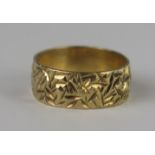 A 9ct Gold Patterned Wedding Band, 7mm wide, size J.5, 2.5g