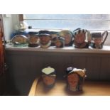 A Collection of Nine Royal Doulton Character Jugs, and three ship's in bottles