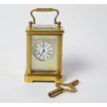 A Sub Miniature Brass Carriage Clock, c. 76mm high to top of handle