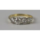 An 18ct Gold and Platinum Diamond Four Stone Ring, EDW 1.5ct, size R.5, 3g