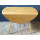 An Ercol Light Elm Drop Leaf Table