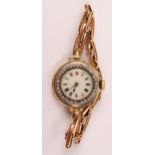 An Antique 18ct Gold Ladies Wristwatch, the 25.5mm Swiss case with diamond set bezel and enamel dial