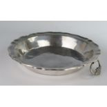 An Antique Unmarked Continental Shaped Silver Bowl with twin foliate decorated handles, 27cm diam.