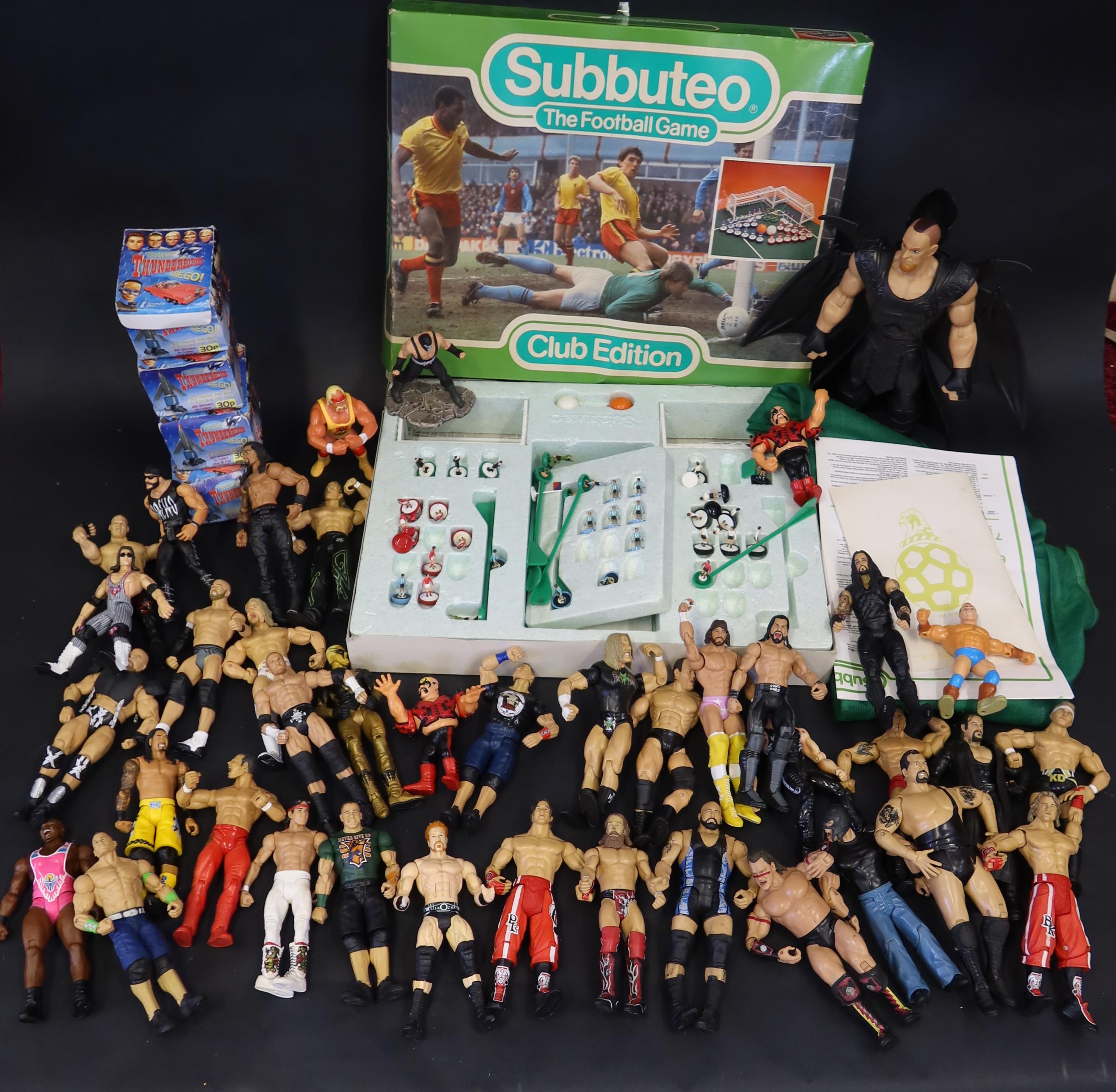 A Collection of Mattel WWE Figures, Subbuteo Game and Thunderbird Collector Sticker Packs