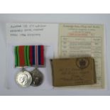 A WWII Two Medal Group with original card box and medal slip sent to Mr. F.T. Wright (pos. Royal
