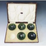 A Cased Set of Five (one missing) Jadeite Bowls retailed by Derfield, 7cm diam. 2.5cm high