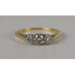 An 18ct Yellow Gold and Diam ond Three Stone Ring, principal stone c. 4.2mm, size Q.5