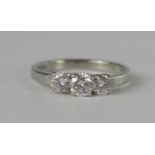 A Platinum and Diamond Three Stone Ring, EDW .70ct, size M.25, 3.7g