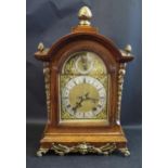 An Oak Cased Mantle Clock striking on two gongs, gilt bronze mounts, 48cm high