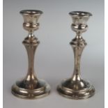 A Pair of George V Loaded Silver Candlesticks, 16cm high, London 1912, maker rubbed