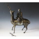 An Antique Chinese Bronze Figure of a Deer with Rider reading a scroll, figure lifts off to reveal