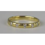 An 18ct Yellow and Diamond Five Stone Band, EDW .3ct, size T, 4.1g