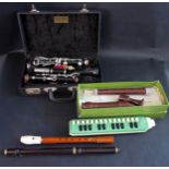 A Boosey & Hawkes Regent Clarinet cased, Hohner Melodica Soprano, Dolmetsch Recorder boxed, Hohner