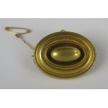 A Victorian Unmarked Gold Locket Back Brooch with safety chain, 33 x 25mm, 6.5g
