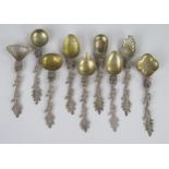 An Unusual Set of Nine Silver Spoon with various shaped bowls (mostly gilded) and with dragon
