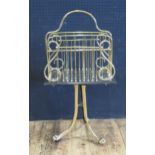 A Brass Lyre Shaped Pedestal Magazine Rack on tripod lion paw base, 84cm high