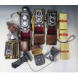 Three Rolleiflex Cameras and accessories