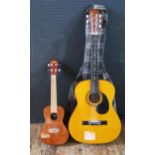 A Vintage Brand VUC50 Ukulele and a classical guitar
