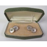 A Pair of 18ct Back and Mother of Pearl Cufflinks with 9ct gold chains, boxed, 4.9g