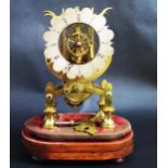 An Early 19th Century Brass Skeleton Clock, the 5" shaped silvered dial with Roman numerals and