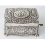 Silver Bird Box Automaton with embossed putti and foliate decoration, c. 11(w)x6(h)x8(d)cm