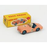 A Dinky Toys 111 Triumph TR2 Sports in salmon pink, blue interior and hubs, white racing driver