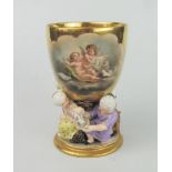 A Rare 18th Century German Porcelain Goblet, the gilt bowl decorated with a cartouche of Putti and