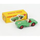 A Dinky Toys 110 Aston Martin DB3 Sports in mid-green with red interior and hubs, white driver and