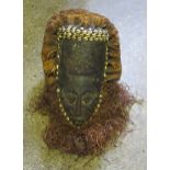 African Mask with cowrie shell decoration