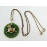 A Chinese Jadeite Pendant decorated with a gold horse (32mm diam.) and on a 20" 14K gold chain (