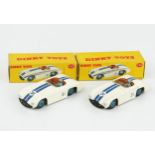 Two Dinky Toys 133 Cunningham C-5R Road Racers in white with dark blue stripes, brown interior,