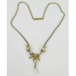 Antique 15ct Gold and Pearl Necklace, the central bow with a 32mm drop and 13.25" chain with