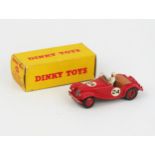 A Dinky Toys 108 MG Midget Sports in red with tan interior, red hubs RN '24', white racing driver in