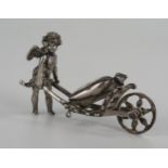 19th Century Continental Silver Cupid bearing a sack barrow, sack marked 1000, 62mm long, 27.8g