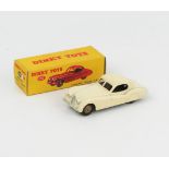 A Dinky Toys 157 Jaguar XK120 Coupe in white with fawn hubs in correct type 2 yellow white sticker