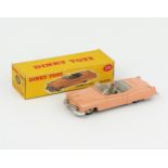 A Dinky Toys 131 Cadillac Tourer in salmon pink with grey interior, driver and hubs in correct