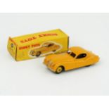 A Dinky Toys 157 Jaguar XK120 Coupe in yellow with light yellow hubs in correct type 1 yellow spot