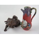 Japanese Sumida Gawa Coffee Pot with applied figures, 21cm high and carved wooden buffalo