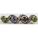 Victorian Ruby, Peridot, Amethyst and Diamond Bar Brooch in an unmarked high carat gold setting,