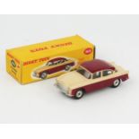 A Dinky Toys 165 Humber Hawk with maroon lower body and roof, cream upper body, silver number