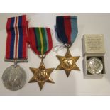 WWII Three Medal Group including Pacific Star, 39-45 star and The King's Badge