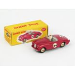 A Dinky Toys 107 Sunbeam Alpine Sports in deep pink with grey interior, cream hubs, RN '34' and