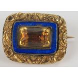 Georgian Unmarked Gold Brooch set with a foil backed citrine or paste and with a blue enamel