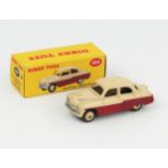 A Dinky Toys 164 Vauxhall Cresta Saloon with maroon lower, cream upper, plain number plate and cream