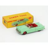A Dinky Toys 132 Packard Convertible in light green with red interior and hubs and grey driver in
